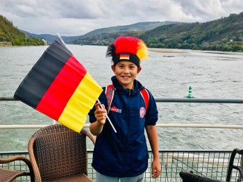 Student with German flag boat ride resized