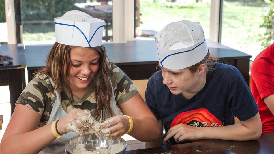 Teenagers making bread