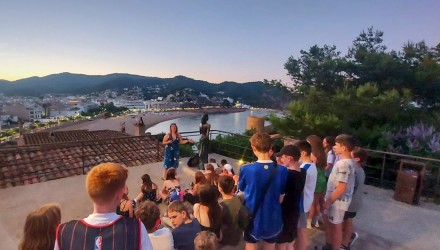School group overlooking Girona in the evening