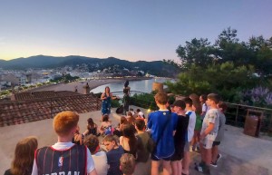 School group overlooking Girona in the evening