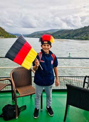 Student with German flag boat ride