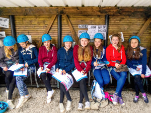 Teenagers with workbooks at Chateau