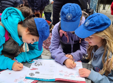 students using workbooks on market mission